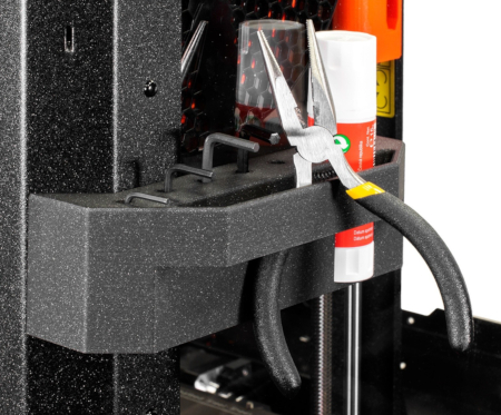 The manufacturer also provided space for tools used when working with the printer