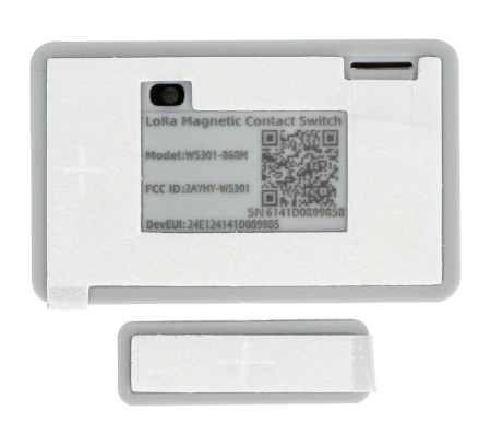 The white Milesight door and window sensor lies underneath on a white background.