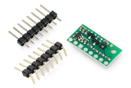 The Pololu pressure and altitude sensor lies on a white background along with the kit components.